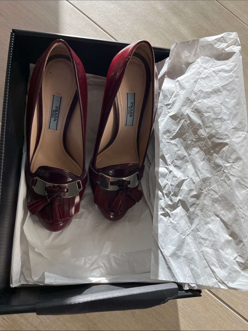 Prada Burgundy Patent Leather Tassel Pumps with Metallic Accent